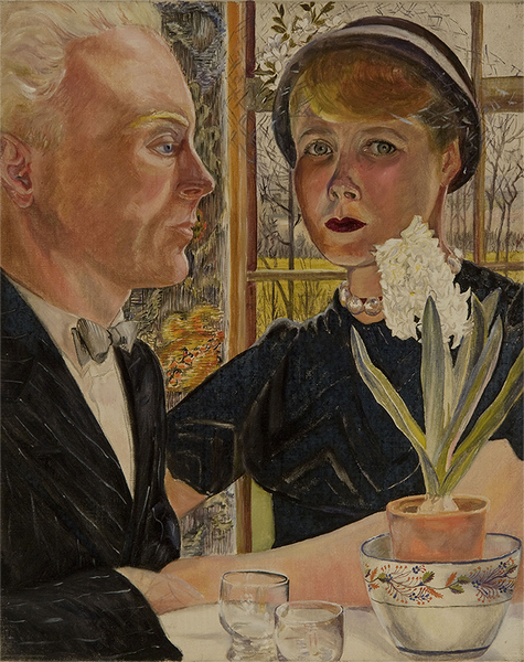 A man, left, wearing a black jacket, and a woman, wearing a black top, hat, and beaded necklace sit at a cafe. On the table are two glasses and a vase of white flowers. The woman, Sylvia Sleigh, looks directly at the viewer.