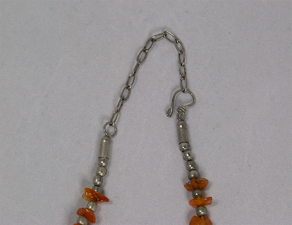 Orange cluster and silver bead necklace