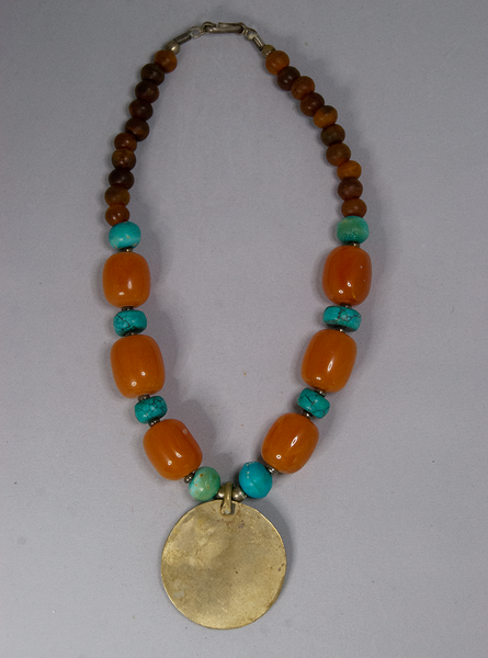 Turquoise, amber, and faux gold pendant necklace