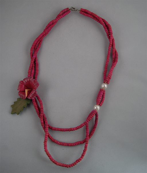 Layered pink beaded necklace with flower