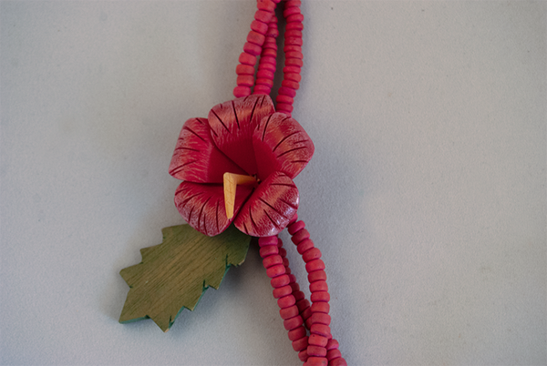 Layered pink beaded necklace with flower