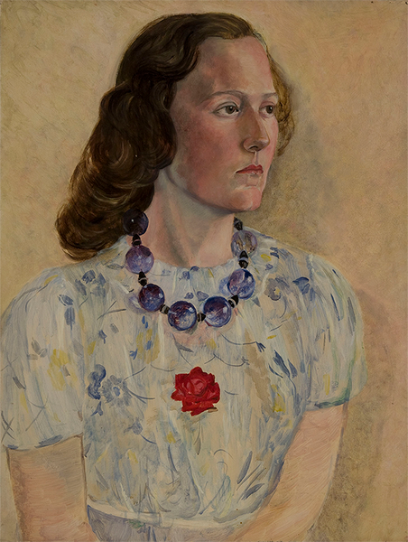 A young woman with pale skin and brown curly hair wears a blue floral print top with a red rose, and blue beaded necklace