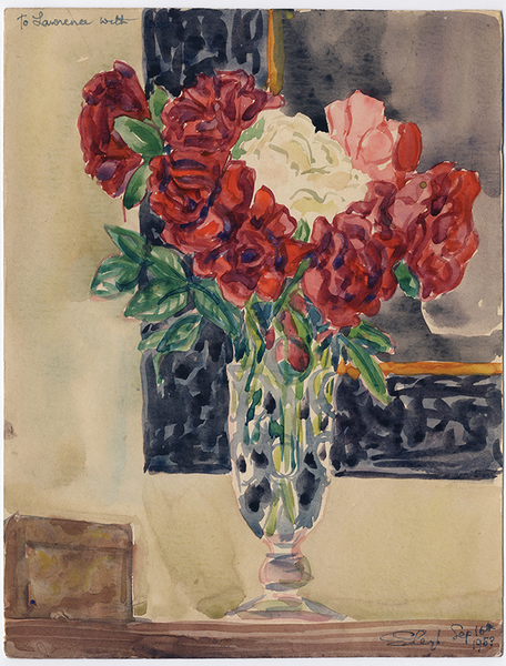 A bouquet of red and white flowers in a glass vase, sits on a wooden surface, in front of a mirror with a dark frame.