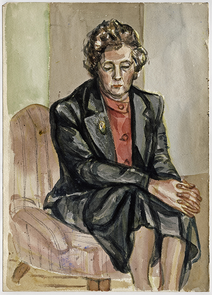 An eldery woman in a black skirt suit and red top sits on a low chair, looking down, with her arms clasped in front.
