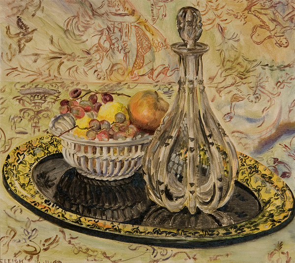 A silver decanter and basket of fruit on a black and gold tray.