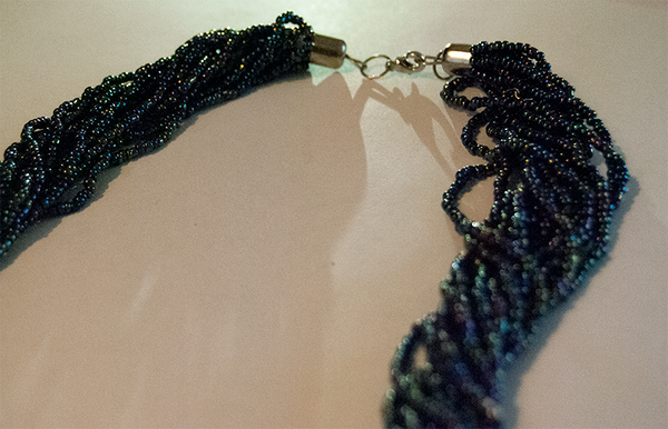 Twisted multi-strand beaded necklace